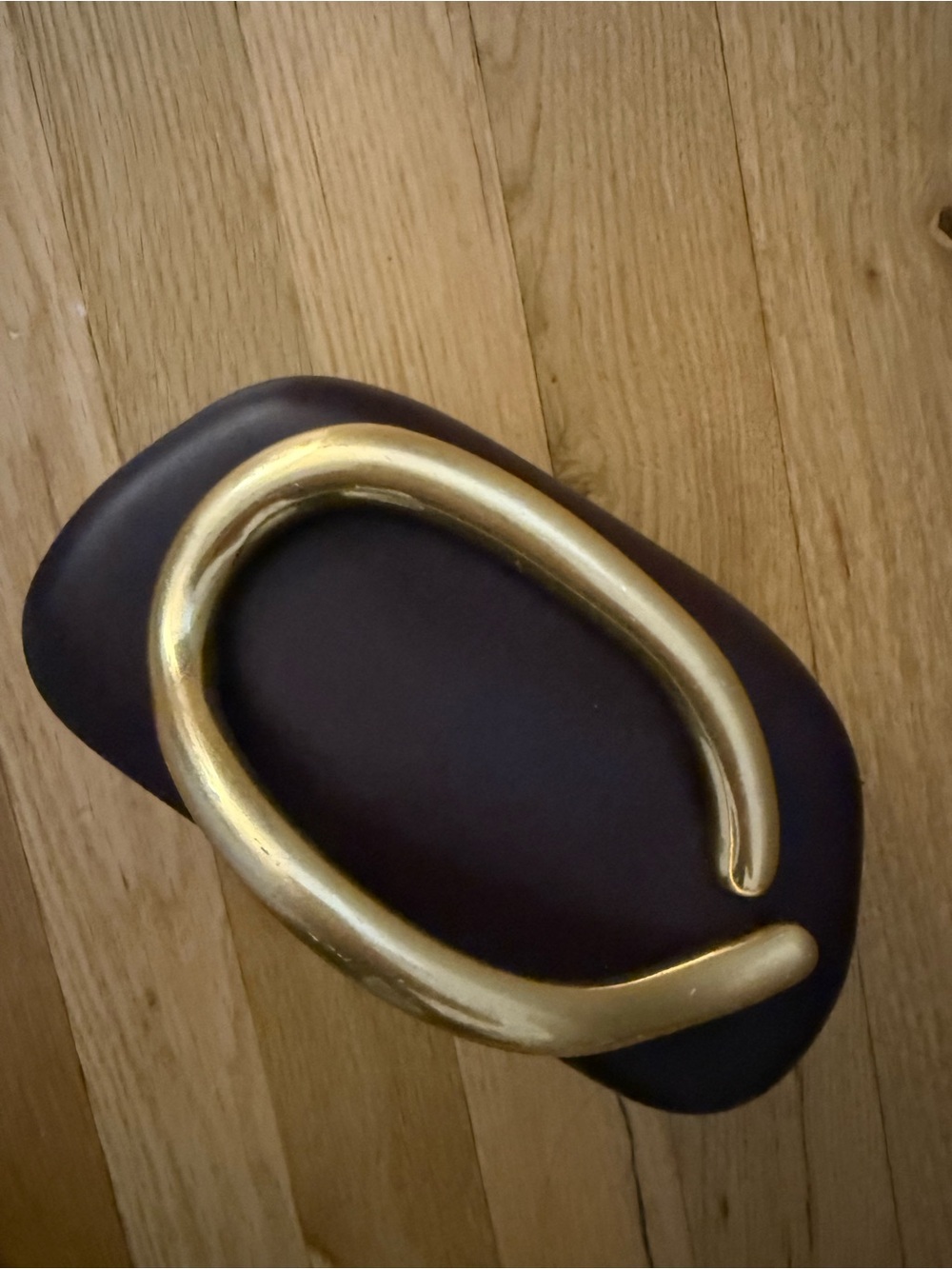 Zara Gold Metal Cuff Bracelet on Dark Brown Leather Display